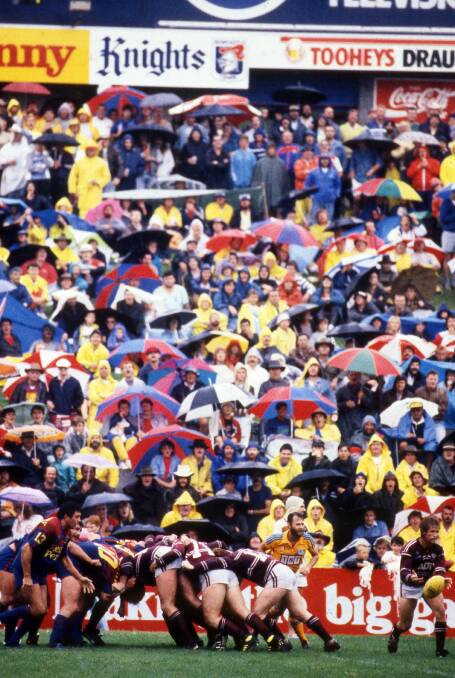 FLASHBACK: A capacity Newcastle crowd shelters from the rain in 1989.