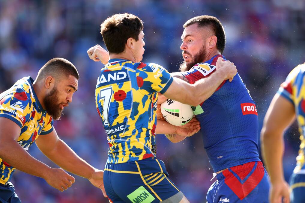 CRASH: Parramatta's Mitchell Moses tackles Newcastle's David Klemmer. Picture: Getty Images