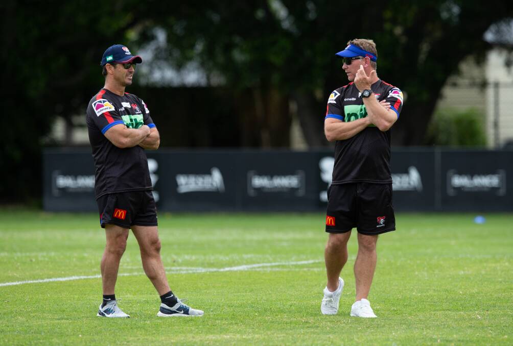 LEGEND: Knights champion Andrew Johns, left, and coach Adam O'Brien.