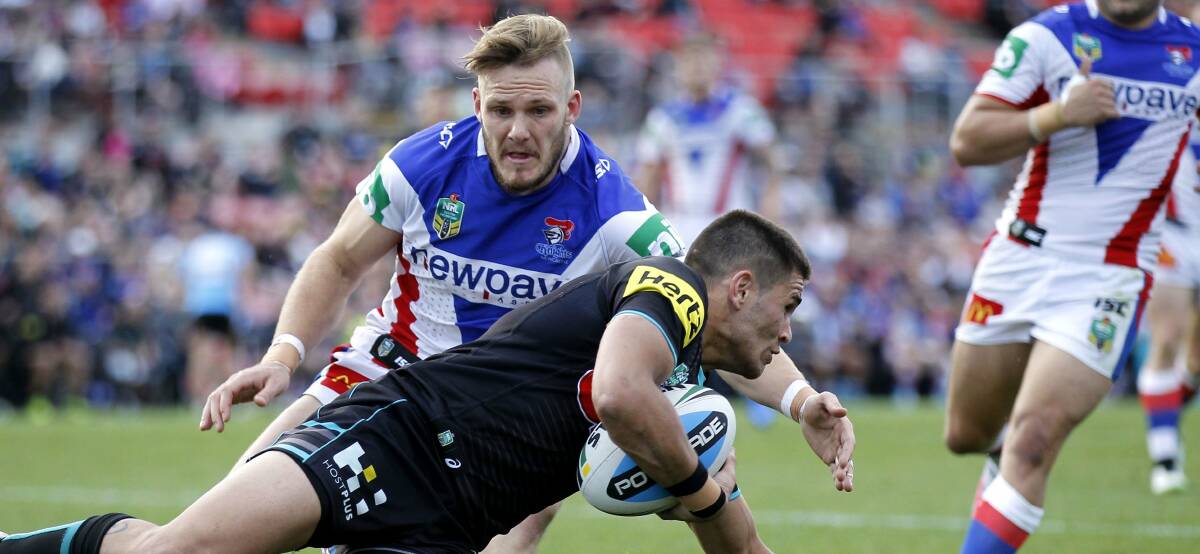 COMMITTED: Nathan Ross tackles Will Smith in Newcastle's last-round loss at Penrith last season. Picture: Darren Pateman