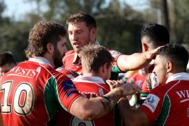 Wests celebrate a try in their win against Macquarie on Sunday. Picture by Peter Lorimer
