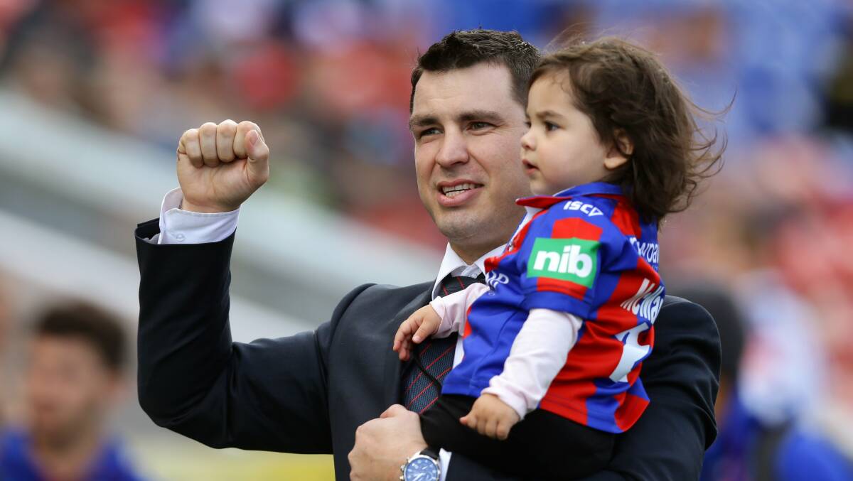 CROWD FAVOURITE: James McManus, with daughter Emelyn, salutes Newcastle's fans after announcing his retirement early in 2016. Picture: Jonathan Carroll