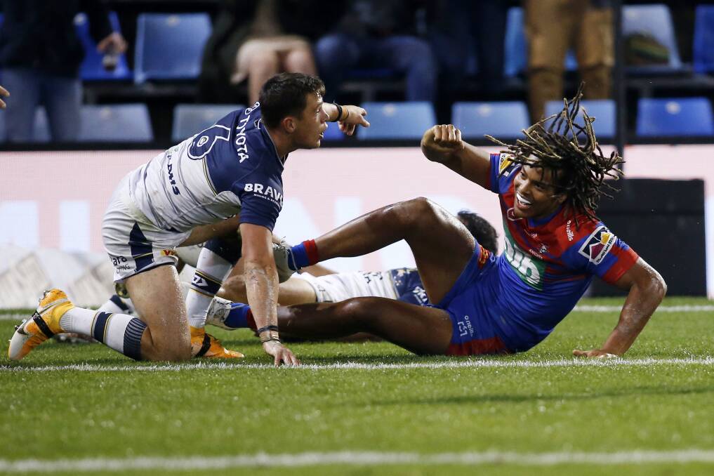 TRY TIME: Dominic Young scores for Newcastle against the Cowboys. Picture: Darren Pateman, AAP