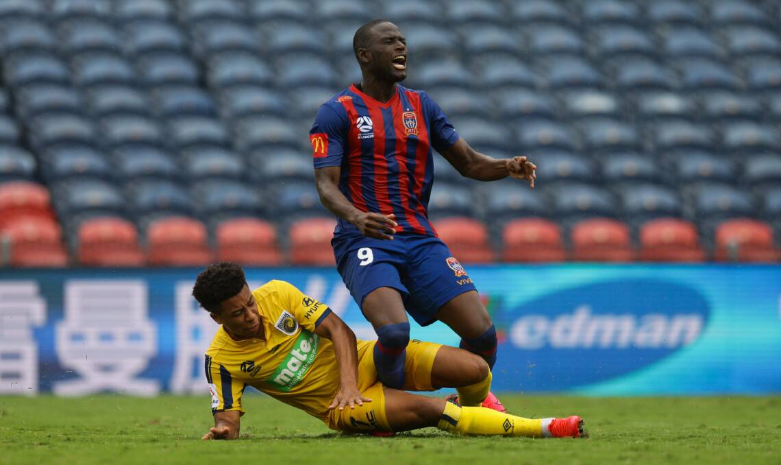 FLASHBACK: Samuel Silvera, playing for the Mariners, tackles Newcastle's Abdiel Arroyo. Picture: Jonathan Carroll 