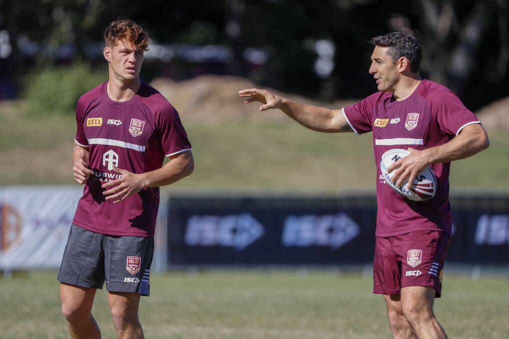 MASTER AND APPRENTICE: Billy Slater gives Kalyn Ponga tips at Queensland's training session on Thursday. Picture: AAP