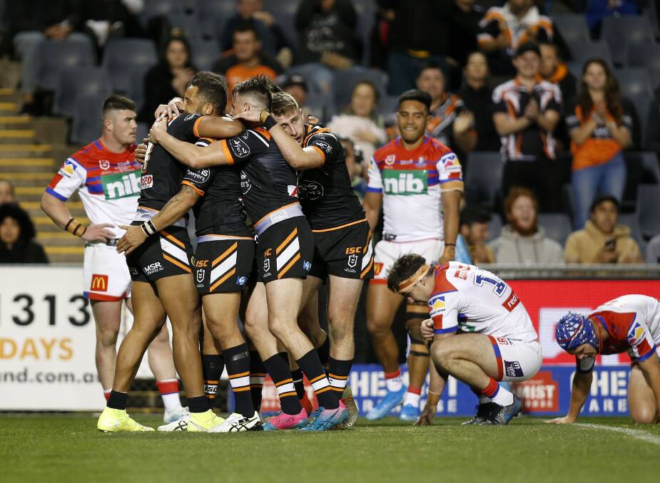 POWER OF PASSION: A picture paints 1000 words as the Wests Tigers celebrate another try in their 46-4 hammering of Newcastle on Saturday. Picture: Darren Pateman, AAP