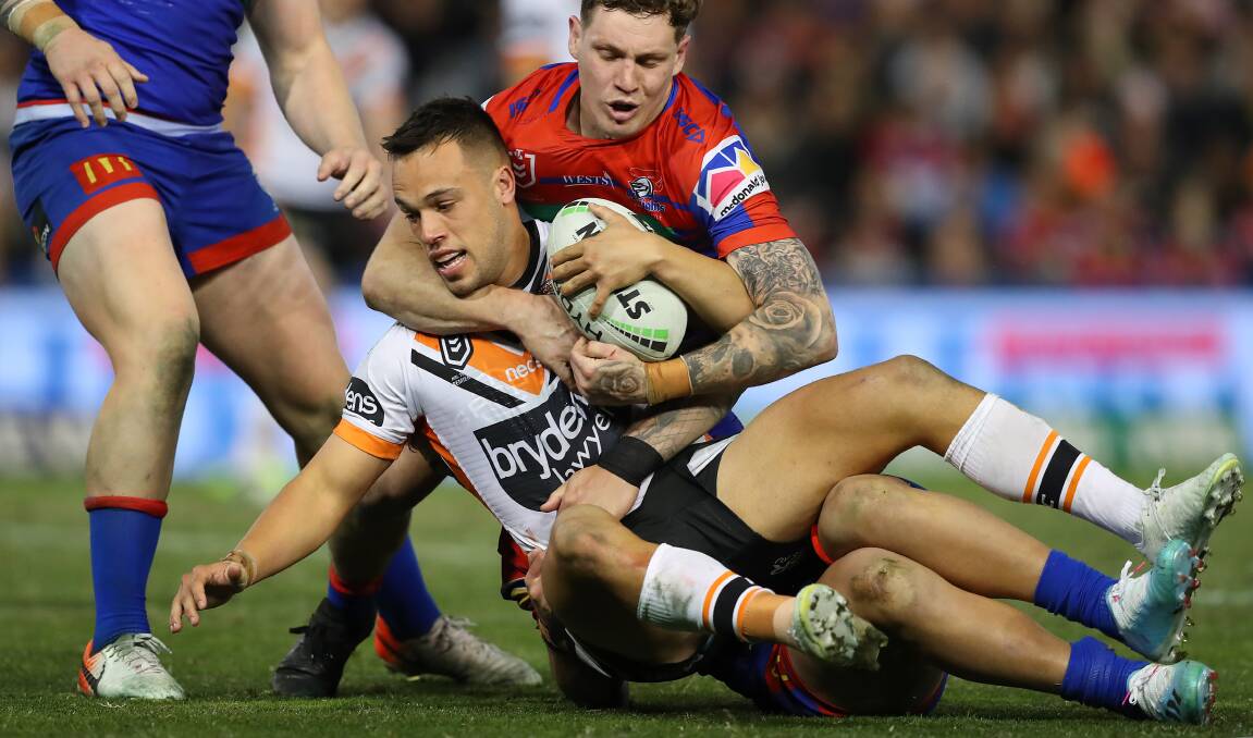HALF A CHANCE: Tigers playmaker Luke Brooks in action against the Knights. Next year he might be wearing their colours. Picture: Getty Images