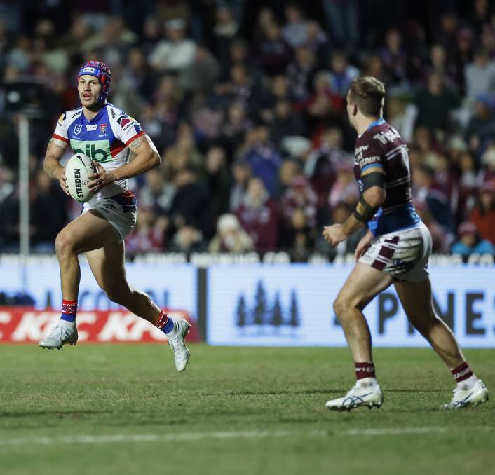 TRIED HARD: Newcastle Knights skipper Kalyn Ponga takes a run at Brookvale Oval on Saturday night. The fullback scored his side's second try to reduce the deficit to 14-12 early in the second half but couldn't inspire a further comeback. Picture: Getty Images