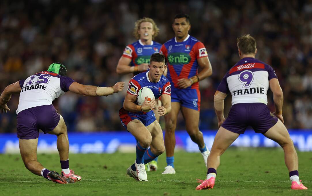 Newcastle Knights playmaker Jack Cogger eyes a gap against Melbourne. Picture by Peter Lorimer