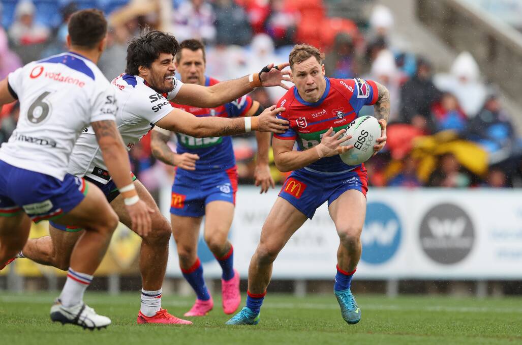 ACTION MANN: Knights fullback Kurt Mann on the attack against the Warriors. Picture: Getty Images