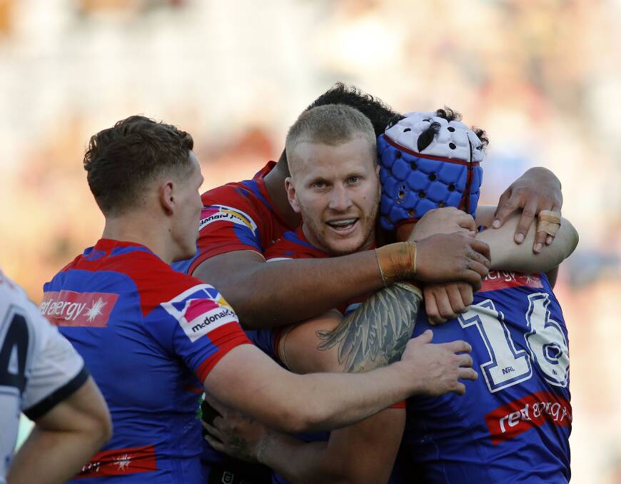 TRY TIME: Mitchell Barnett celebrates after scoring against the Cowboys. Newcastle found form at just the right time to launch a push for the finals. Picture: Darren Pateman, AAP