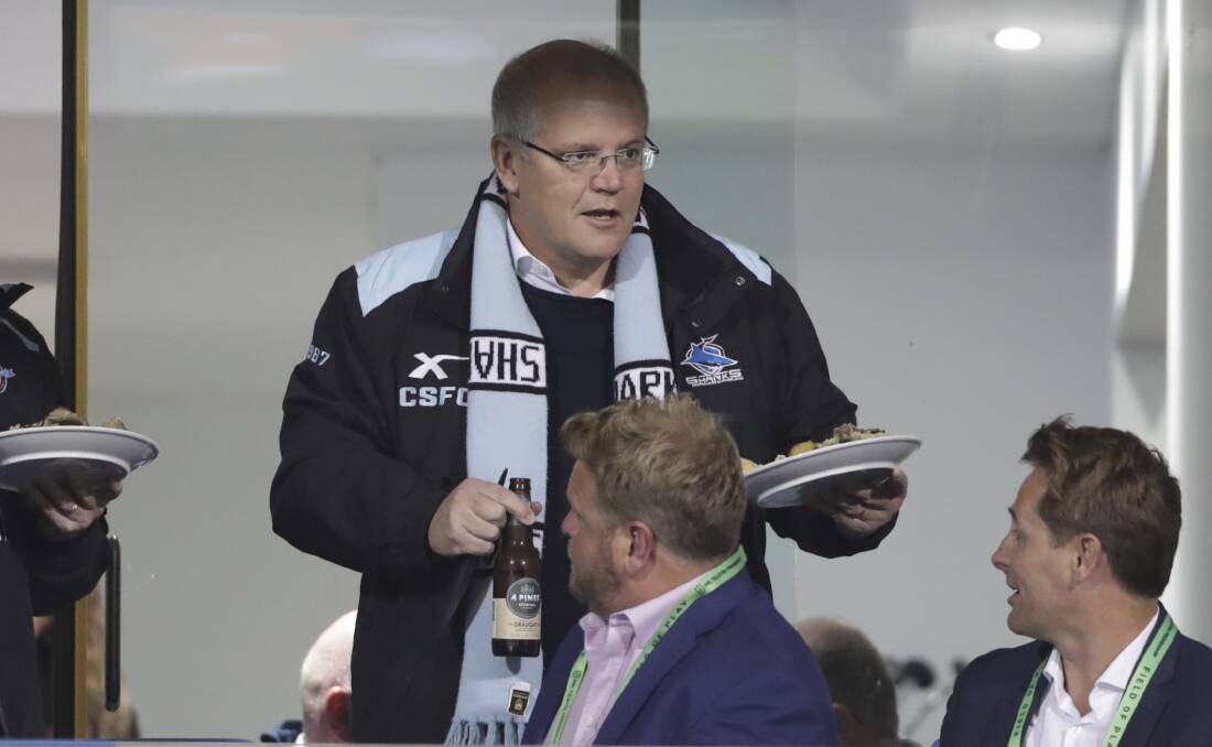 FOOD FOR THOUGHT: Prime Minister Scott Morrison has been known to frequent the Sharks' dressing room after games, joining in the team song. How embarrassing. Photo: Alex Ellinghausen