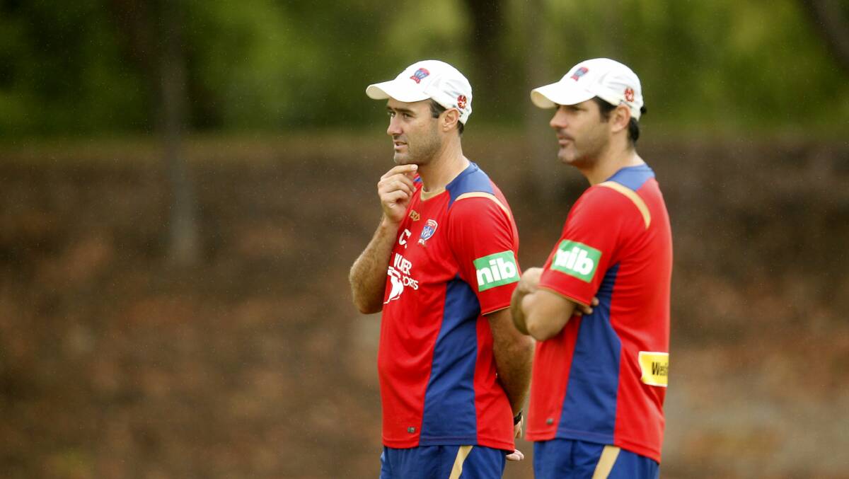 WEALTH OF KNOWLEDGE: Clayton Zane, left, during his stint as Newcastle's head coach in 2014, alongside assistant Craig Deans. Picture: Jonathan Carroll
