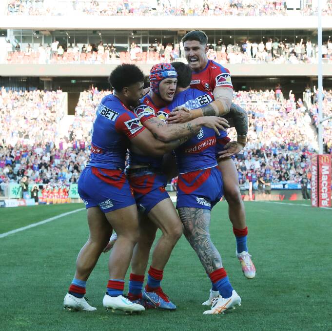 The Knights celebrate Kalyn Ponga's opening try. Picture by Peter Lorimer