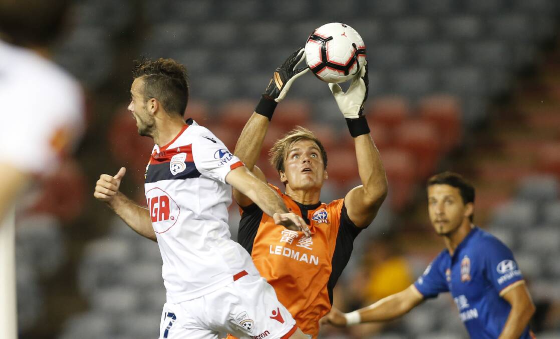 SAFE HANDS: Lewis Italiano latches onto a cross during his debut for the Jets, against Adelaide on Sunday night. Picture: Darren Pateman, AAP