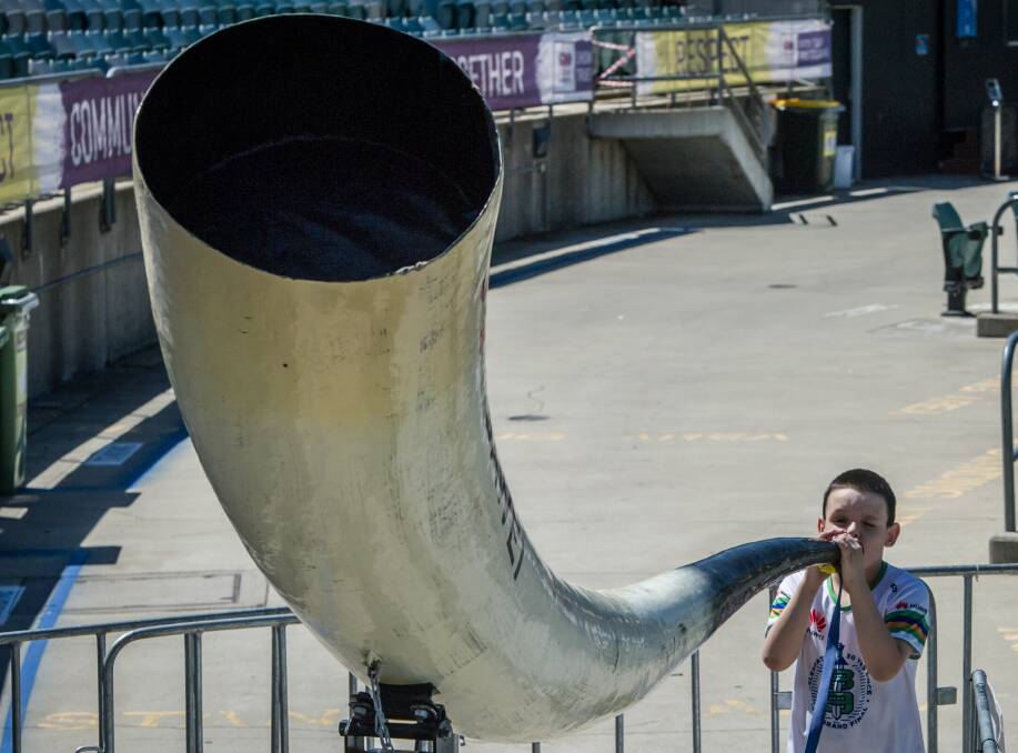 HAVING A BLAST: Canberra fan Jordan Sims tries out the Viking horn, which will accompany the Raiders to ANZ Stadium on Sunday. Picture: Karleen Minney