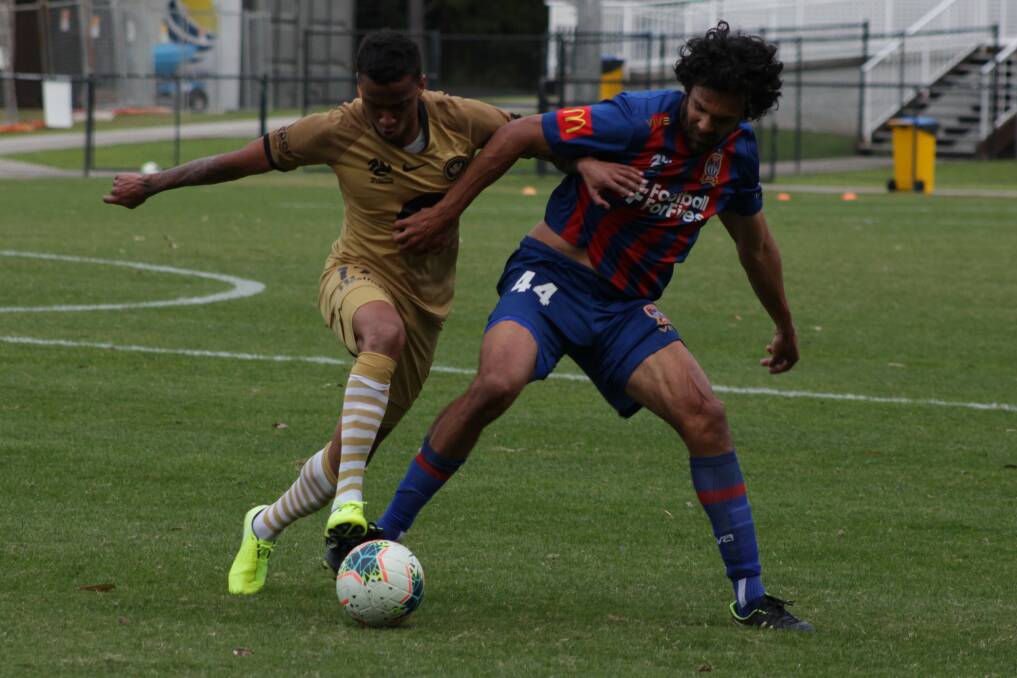 PUSHING THE FRIENDSHIP: Newcastle defender Nikolai Topor-Stanley battles to control the ball against Wanderers on Wednesday. Picture: Jets Media