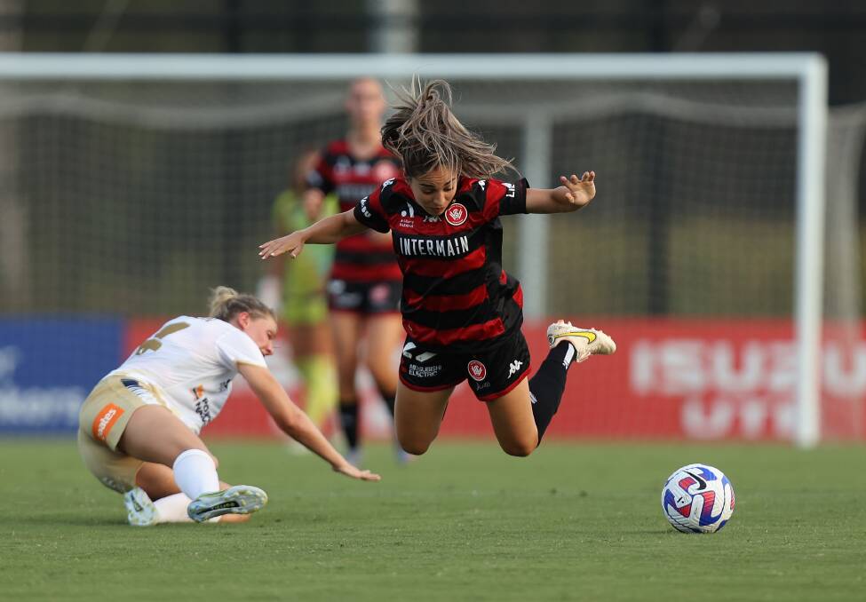 Newcastle's Lucy Johnson upends Western Sydney's Melissa Caceres on Saturday. Picture by Tim Allsop, Getty Images