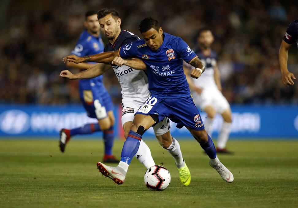 PROBING: Newcastle's Ronny Vargas on the ball against Melbourne Victory. 