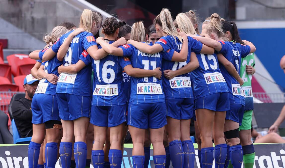 SISTERS IN ARMS: The Newcastle Jets in their pre-game huddle. Last week we ran the same image on the back page, cropped from the waist down, to mixed reviews. Picture: Getty Images