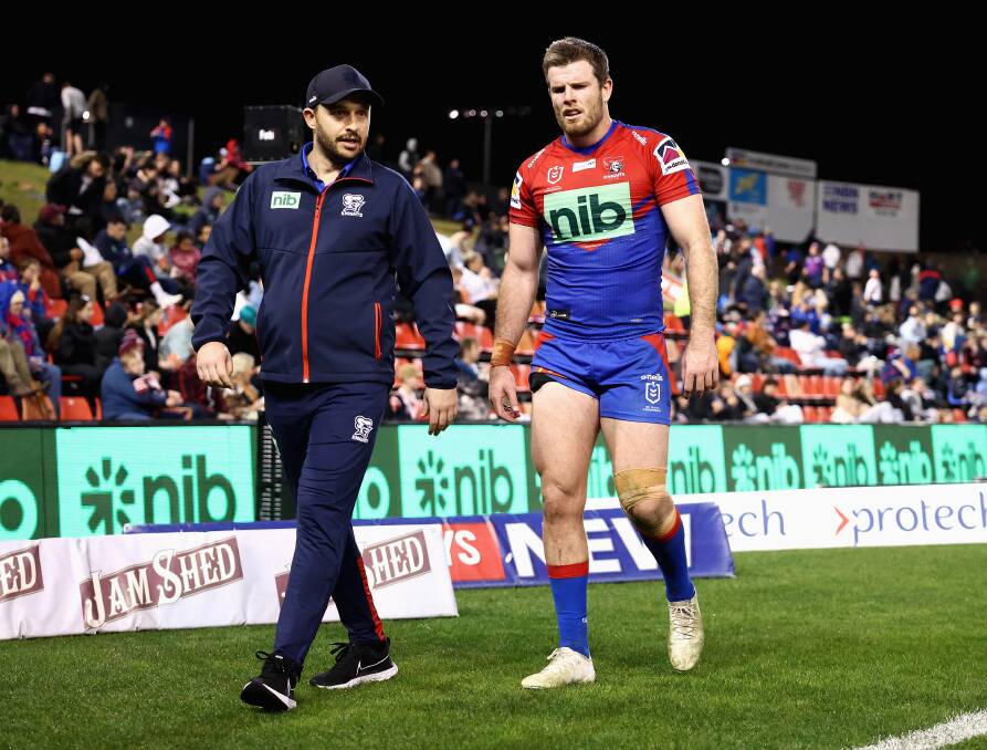 Knights forward Lachlan Fitzgibbon leaves the field against the Sydney Roosters last season. He underwent season-ending shoulder surgery soon afterwards. Picture by Getty Images