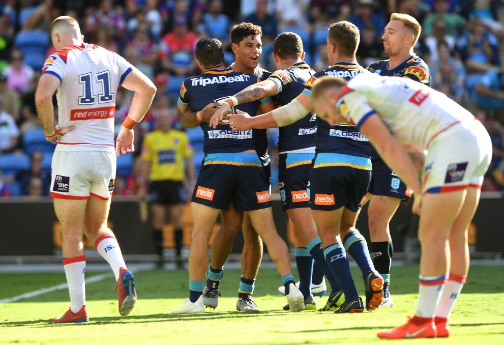 THAT HURTS: Gold Coast centre Brin Kelly celebrates his try against the Knights. Picture: AAP