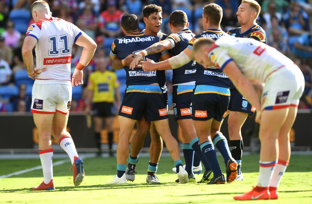 THAT HURTS: Gold Coast
centre Brian Kelly celebrates
his try against the Knights.
Picture: AAP