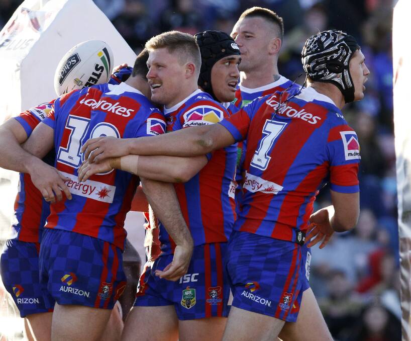 BEEN THERE, WON THAT: Newcastle Knights players celebrate their victory against Penrith at Panthers Stadium on Saturday. Picture: Darren Pateman, AAP