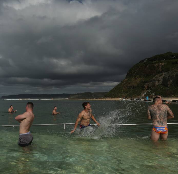WATER TORTURE: Knights fullback Kalyn Ponga splashes teammate Shaun Kenny-Dowall during Monday's recovery session at Merewether. Picture: Simone De Peak