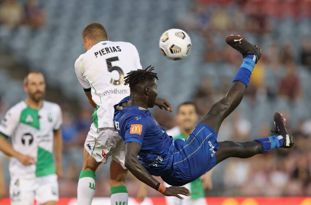 HEAD OVER HEELS: Newcastle's Valentino Yuel has a shot at goal. Picture: Getty Images