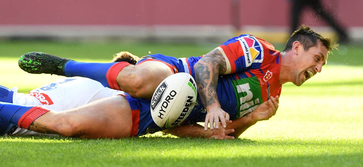 TRY TIME: Newcastle Knights skipper Mitchell Pearce celebrates after scoring against Canterbury at Suncorp Stadium on Saturday. It was his third try in as many games. Pictures: AAP