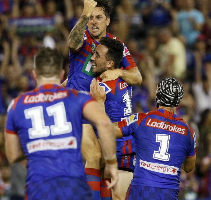 THAT'S GOLD: Newcastle captain Mitchell Pearce and teammates celebrate after their extra-time with against Manly. Picture: Darren Pateman
