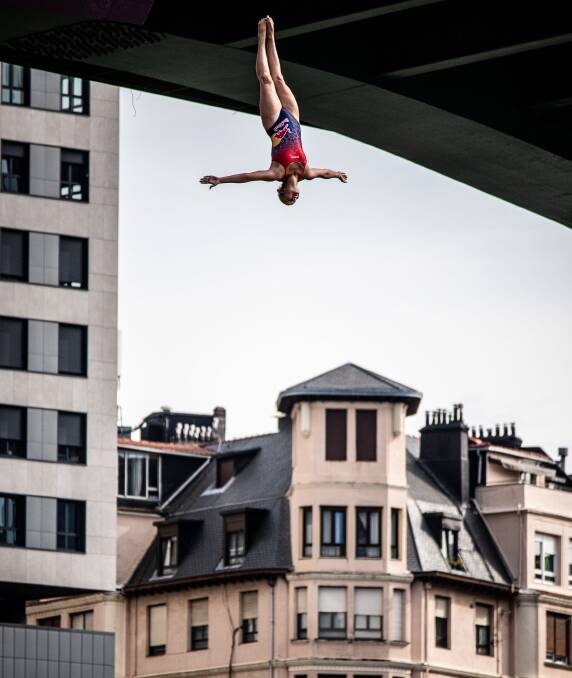 THRILL-SEEKER: Rhiannan Iffland dives from the 21-metre platform on her way to victory in the Red Bull world series event in Bilbao, Spain. Picture: Dean Treml/Red Bull via Getty Images