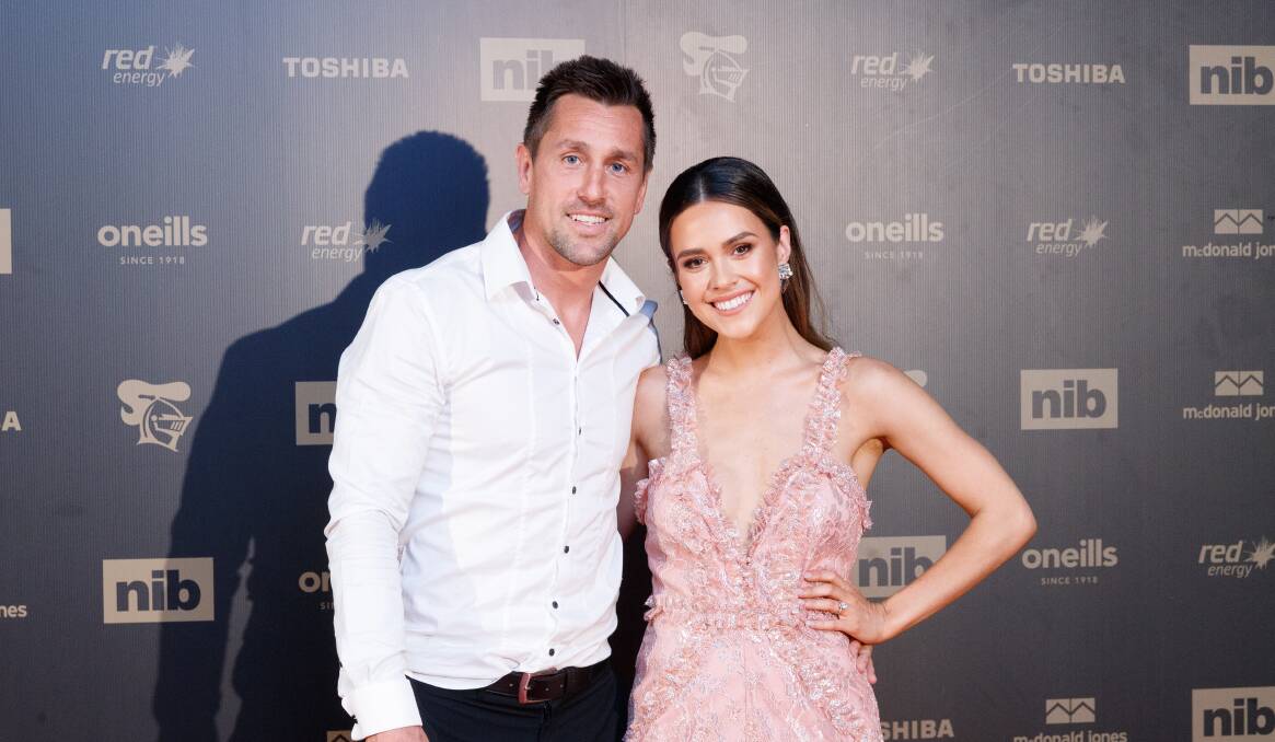 AWKWARD: Knights skipper Mitchell Pearce and his fiancee, Kristin Scott, have postponed their wedding. Picture: Max Mason-Hubers