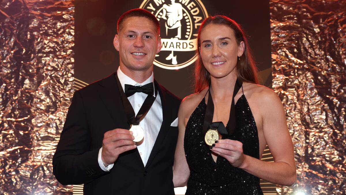 Kalyn Ponga and Tamika Upton with their Dally M gold medals on Wednesday night. Picture Getty Images