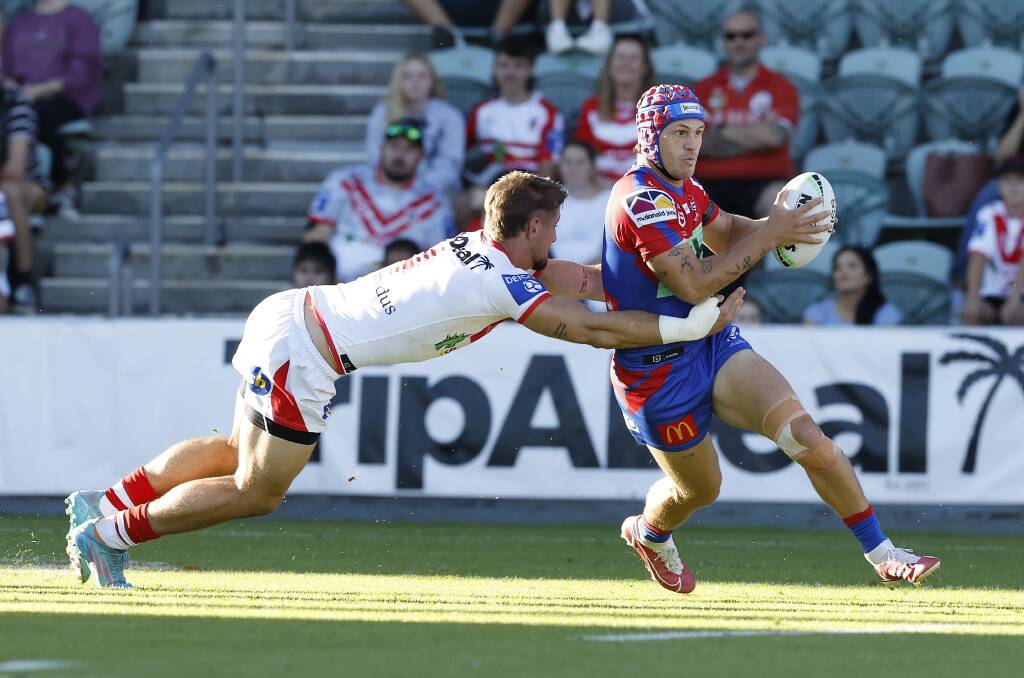 HANDFUL: Kalyn Ponga on the burst against the Dragons. Picture: Getty Images