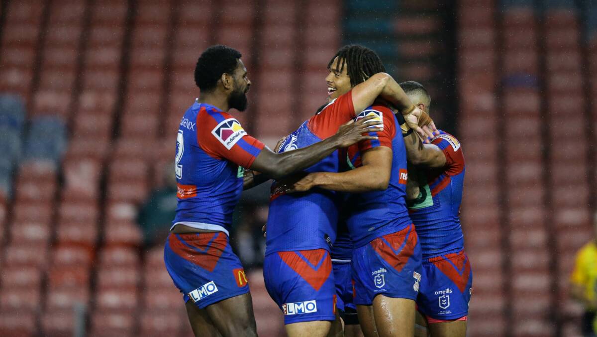 KNIGHT SHIFT: Newcastle celebrate a try in their breakthrough win against Gold Coast on Friday. Picture: Jonathan Carroll