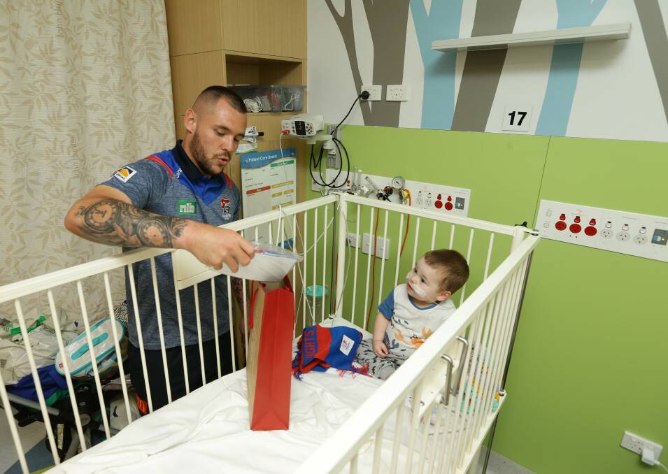  SHARING AND CARING: David Klemmer visits young Tyson.