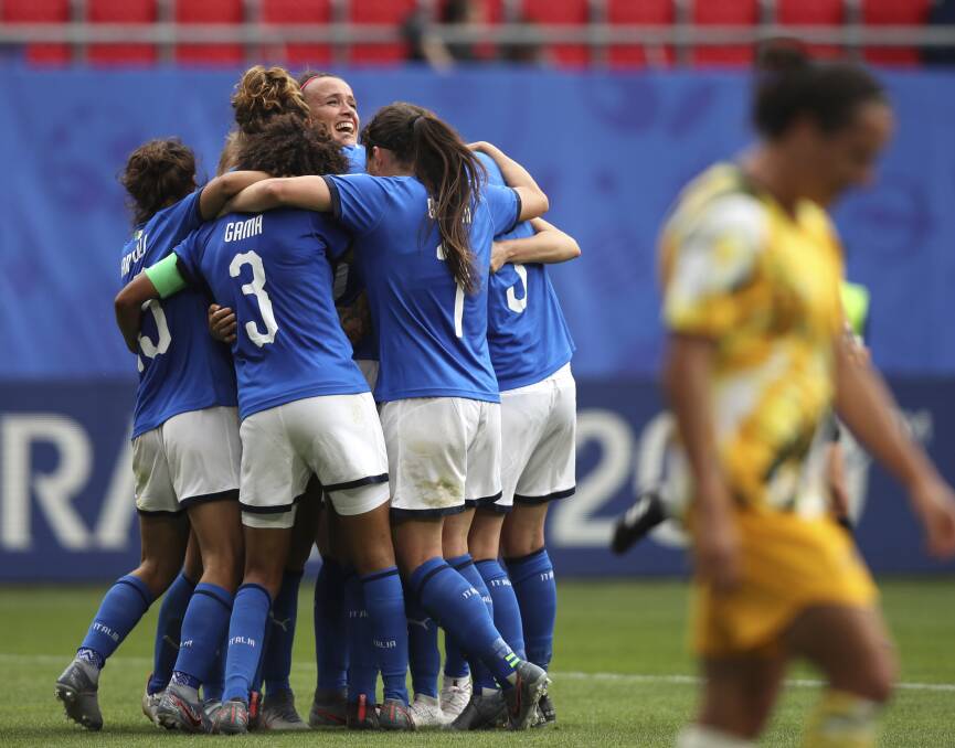 WAKE-UP CALL: Italian players celebrate after winning the Women's World Cup Group C soccer match against Australia at the Stade du Hainaut in Valenciennes. Picture: AP