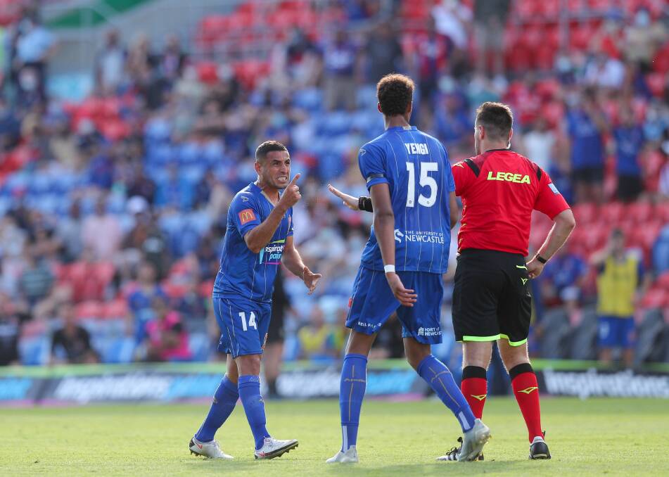 BOILING POINT: Newcastle's Ali Abbas pleads with referee Ben Abraham to award a penalty after a last-minute hand-ball. Picture: Max Mason-Hubers