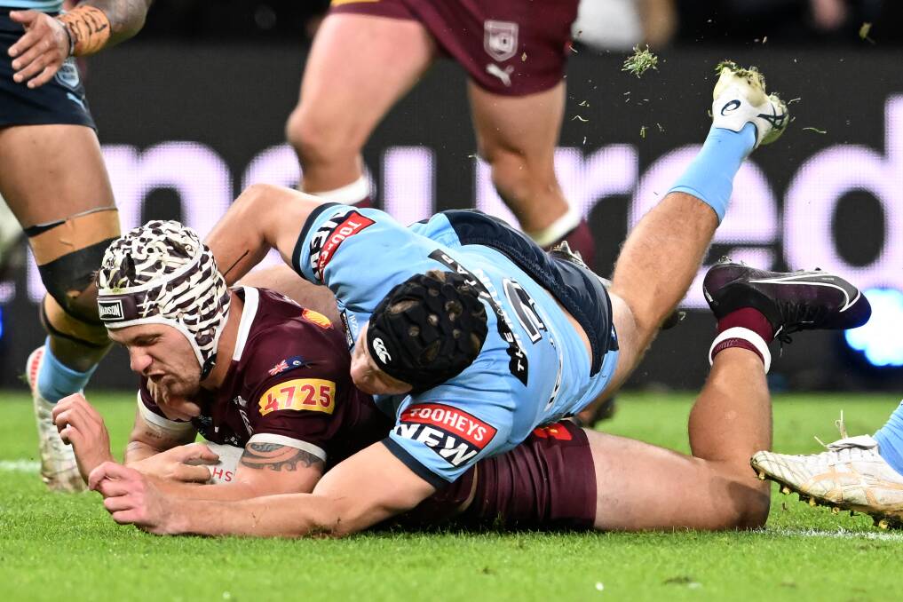 TRY TIME: Kalyn Ponga scores against NSW at Suncorp Stadium on Wednesday night. He was named man of the match after an outstanding all-round display. Picture: Getty Images