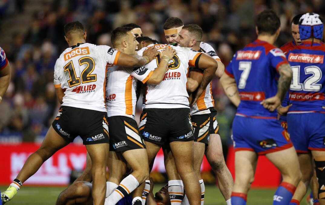 THAT HURTS: Newcastle's loss to the Wests Tigers on Friday night was a setback in their quest to make the finals for the first time since 2013. Picture: Darren Pateman, AAP