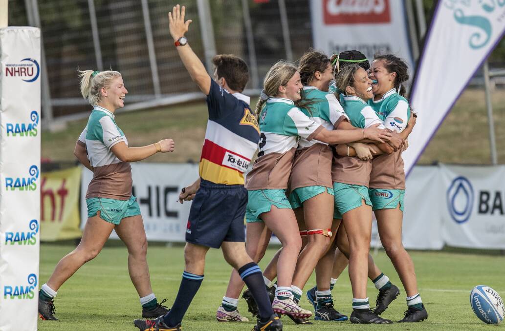 ON A ROLL: The Hunter Wildfires celebrate a try in the 29-19 win over Sydney University (2) in the major semi-final. Picture: Stewart Hazell
