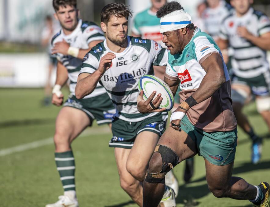 TOUGH DAY: Centre Nimi Qio tries to get away from the Warringah defence in the Wildfires 50-15 loss at No.2 Sportsground on Saturday. Picture: Stewart Hazell
