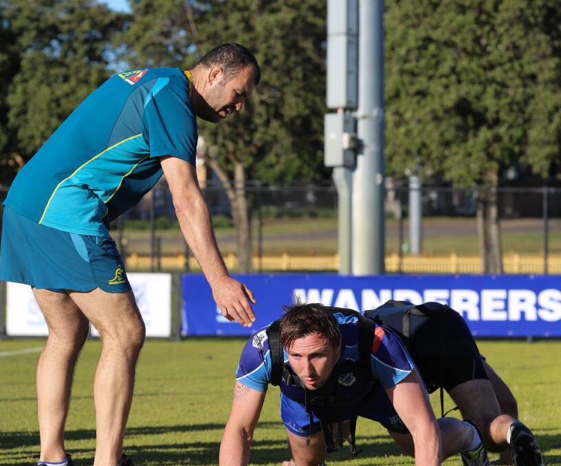 NATIONAL WORKOUT: Wallabies coach Michael Cheika puts Wanderers second-rowers Marcus Christensen and Ignacio Battilana through a drill on Tuesday. Pictures: ARU Media
