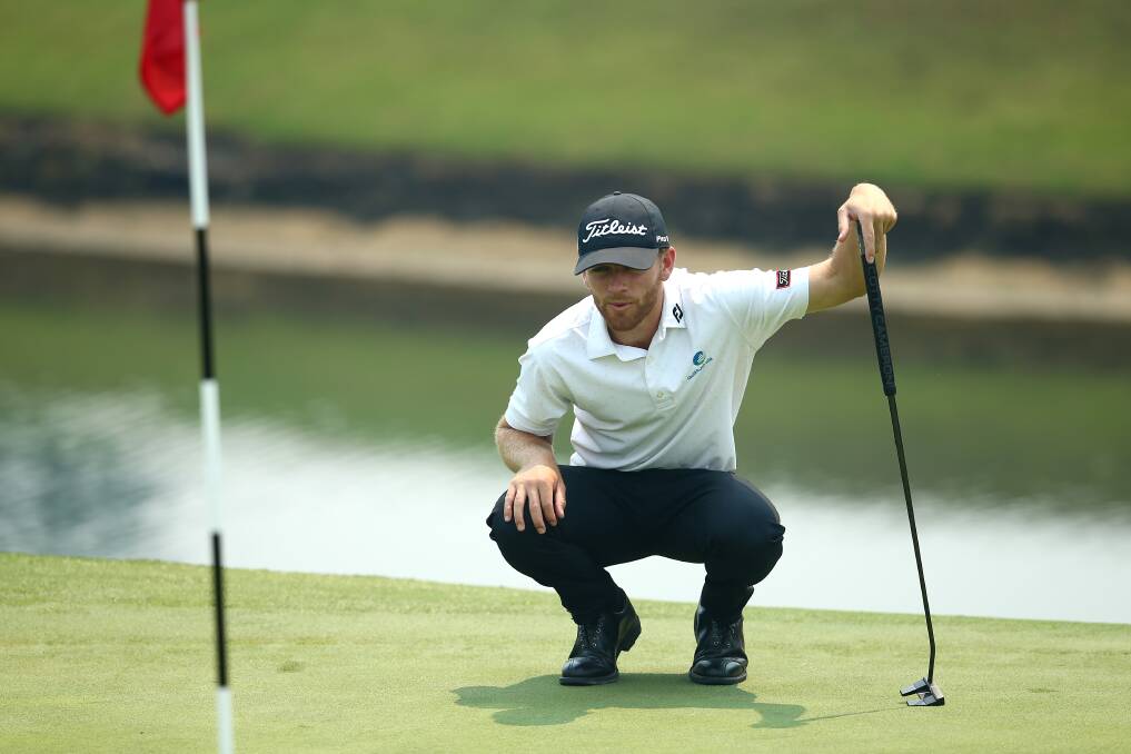 IN THE ZONE: Blake Windred surveys a putt. The rookie Charlestown professional is tied for 12th at the halfway point of the Australian Open. Picture: Getty Images