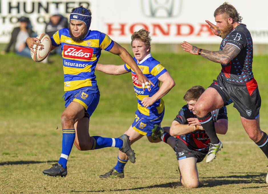 OFF AND RUNNING: Hamilton centre Fiso Vasegote breaks free from a tackle in the Hawks' 47-29 win over Maitland at Marcellin Park on Saturday. Picture: Stewart Hazell