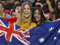 ROO BEAUTY: Australia fans celebrate after the Socceroos win in Doha. Picture: AAP