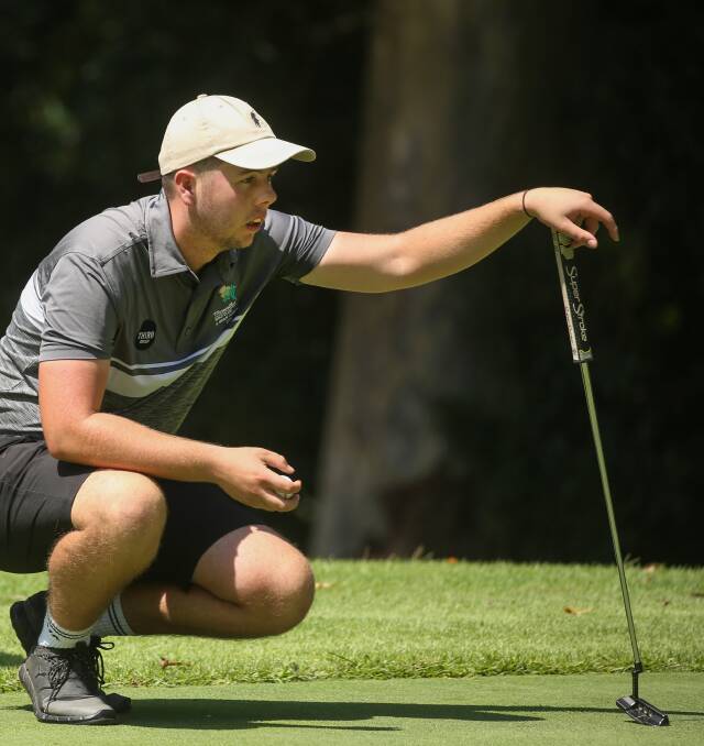 FOCUSED: Merewether co-captain Luke Ferrier lines up a putt. Picture: Marina Neil