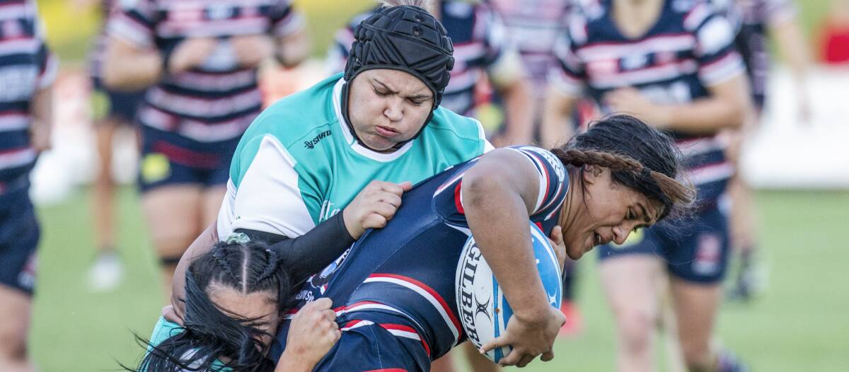 BRUISING: Candice Clay makes a tackle over the top in the loss to Easts. Picture: Stewart Hazell